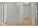 Hallway view showcasing the home's neutral color palette, laminate floors, white doors, and modern aesthetic at 1098 Timber Creek Dr # 2, Carmel, IN 46032