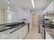 This kitchen features granite countertops, stainless steel appliances, and white cabinets at 1098 Timber Creek Dr # 2, Carmel, IN 46032