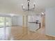 Bright living room open to kitchen features wood floors and sliding glass doors to outside at 1098 Timber Creek Dr # 2, Carmel, IN 46032