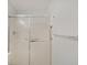 This bathroom shower has sliding glass doors and chrome hardware at 1098 Timber Creek Dr # 2, Carmel, IN 46032