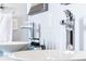 Close-up of the modern bathroom sinks with chrome faucets and luxury soaps at 1112 Spann Ave, Indianapolis, IN 46203