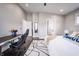 Bright bedroom with a desk, a large bed, hardwood floors, and en suite bathroom at 1112 Spann Ave, Indianapolis, IN 46203