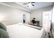 Bright bedroom featuring a ceiling fan, desk, and ample natural light at 1112 Spann Ave, Indianapolis, IN 46203