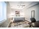 Cozy bedroom offering a comfortable bed and a view of the outdoors at 1112 Spann Ave, Indianapolis, IN 46203
