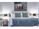 Modern bedroom with king bed, soft gray linens, contemporary lighting, and stylish wall art at 1112 Spann Ave, Indianapolis, IN 46203