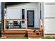 Inviting front porch with stylish furniture and wood railing, perfect for relaxing at 1112 Spann Ave, Indianapolis, IN 46203