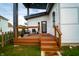 Inviting front porch with stylish seating, wood railing, and modern design at 1112 Spann Ave, Indianapolis, IN 46203
