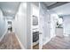 Hallway view showing in-unit washer and dryer at 1112 Spann Ave, Indianapolis, IN 46203