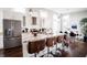 Bright, open kitchen featuring a large island, granite countertops, and stainless steel appliances at 1112 Spann Ave, Indianapolis, IN 46203