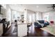 Open concept kitchen and living area with a granite island and hardwood flooring at 1112 Spann Ave, Indianapolis, IN 46203