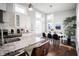 Bright, eat-in kitchen featuring granite countertops, island with seating, and natural light at 1112 Spann Ave, Indianapolis, IN 46203