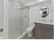 Bathroom with glass-enclosed shower, modern vanity, and stylish tile flooring offers a luxurious and functional space at 11245 Old Stone Dr, Indianapolis, IN 46236