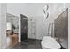 Bright bathroom with modern lighting, glass enclosed shower, stylish fixtures, freestanding tub and marble accents at 11245 Old Stone Dr, Indianapolis, IN 46236
