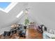 Bright bonus room features hardwood floors, skylights, a ceiling fan, and plenty of room for to play and a drum set at 11245 Old Stone Dr, Indianapolis, IN 46236