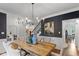 Open dining room showcasing a large wooden table and sophisticated decor, perfect for entertaining guests at 11245 Old Stone Dr, Indianapolis, IN 46236