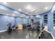 Spacious home gym features rubber flooring, mirrored walls, and a variety of workout equipment for a complete fitness experience at 11245 Old Stone Dr, Indianapolis, IN 46236