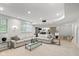 Spacious living room with plush sofa, glass coffee table, and recessed lighting for comfortable living and entertaining at 11245 Old Stone Dr, Indianapolis, IN 46236