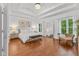 Serene main bedroom with tray ceilings, hardwood floors, and natural light, offering a tranquil retreat at 11245 Old Stone Dr, Indianapolis, IN 46236