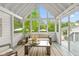 Bright sunroom with vaulted ceilings and panoramic views offers a serene retreat for relaxation and enjoyment of nature at 11245 Old Stone Dr, Indianapolis, IN 46236