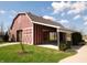 Community barn with an open-air pavilion, landscaping, and a paved walkway at 11277 N Greenthread Dr, Monrovia, IN 46157