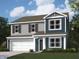 Charming two-story home with a two-car garage, blue siding, and gray shingle accents at 11277 N Greenthread Dr, Monrovia, IN 46157