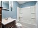 Cozy bathroom featuring a white shower-tub combo, toilet, and vanity with mirror at 11600 N 100 E, Morristown, IN 46161