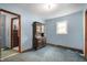 Bedroom with light blue walls, a window, and a vintage wooden hutch at 11600 N 100 E, Morristown, IN 46161