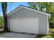 Attached single car garage featuring white door and light gray siding at 11600 N 100 E, Morristown, IN 46161