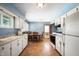 Spacious kitchen and dining area, offering white cabinetry, modern appliances, and a welcoming atmosphere for meals at 11600 N 100 E, Morristown, IN 46161