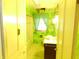 Bright bathroom featuring patterned wallpaper and a shower-tub combo at 1207 Van Buskirk Rd, Anderson, IN 46011