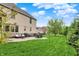 Well-maintained backyard featuring a patio, lush lawn, and beautiful landscaping, ideal for relaxation at 12152 Teal Ln, Carmel, IN 46032