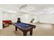 Finished basement features a pool table, cozy seating area, and carpeted flooring at 12152 Teal Ln, Carmel, IN 46032