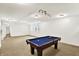 Finished basement with a pool table, multiple lights, and carpeted flooring at 12152 Teal Ln, Carmel, IN 46032