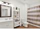 Bathroom with modern vanity, decorative shelves, and tiled floors at 12152 Teal Ln, Carmel, IN 46032