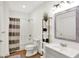 Modern bathroom features a shower/tub combination, stylish shelves, and a decorative mirror at 12152 Teal Ln, Carmel, IN 46032