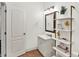 Modern bathroom includes vanity, tile floors, and stylish decor at 12152 Teal Ln, Carmel, IN 46032