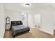 Cozy bedroom featuring a comfortable bed, natural light, and ensuite bathroom entrance at 12152 Teal Ln, Carmel, IN 46032