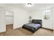 Bedroom features large window, large closet, and a neutral color palette at 12152 Teal Ln, Carmel, IN 46032