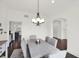 Spacious dining room with an arched doorway and a view of the kitchen at 12152 Teal Ln, Carmel, IN 46032