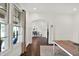 Hallway leading to the dining room with large windows and natural light at 12152 Teal Ln, Carmel, IN 46032
