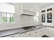Elegant kitchen featuring white cabinetry, subway tile backsplash, and stainless steel appliances at 12152 Teal Ln, Carmel, IN 46032