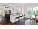 Open-concept kitchen boasts an island with bar seating and stainless steel appliances, perfect for entertaining at 12152 Teal Ln, Carmel, IN 46032