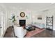 Cozy living room with a fireplace, comfortable seating, and abundant natural light at 12152 Teal Ln, Carmel, IN 46032