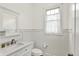Charming powder room with elegant wainscoting, stylish fixtures, and a well-lit mirror at 12152 Teal Ln, Carmel, IN 46032
