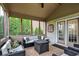 Inviting screened porch with a fire pit, offering an ideal space for relaxation and outdoor enjoyment at 12152 Teal Ln, Carmel, IN 46032