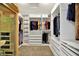 Organized walk-in closet with custom shelving, drawers, and hanging racks at 12152 Teal Ln, Carmel, IN 46032