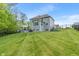 Expansive backyard showcasing a large lawn, private patio, and a well-maintained exterior at 12811 Corydon Dr, Fishers, IN 46037
