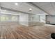 Spacious finished basement featuring recessed lighting, wood-look floors, and multiple windows for lots of natural light at 12811 Corydon Dr, Fishers, IN 46037