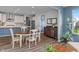 Dining area with ample seating, a stylish sideboard, and views into the kitchen and living spaces at 12811 Corydon Dr, Fishers, IN 46037
