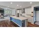 Modern kitchen with a spacious island, stainless steel appliances, and plenty of cabinet space at 12811 Corydon Dr, Fishers, IN 46037